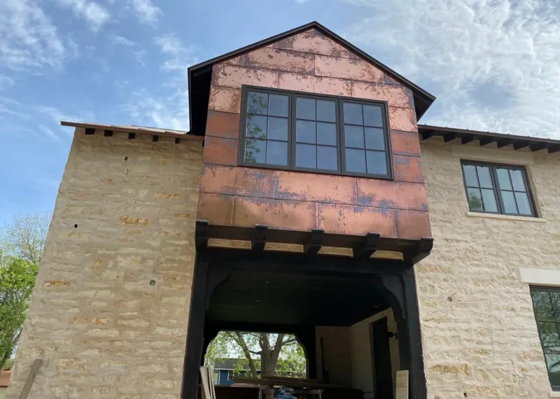 Copper metal panel facade on a stone building for Metal Roof Coating in Ashland